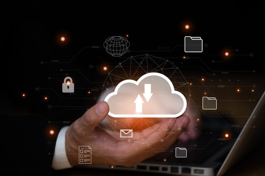 businessman uses a Laptop with technology cloud computing for data transmission, database, data storage, and backup. Networking and internet service concept. Futuristic business network concept.