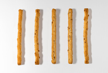 Long breadsticks on white background