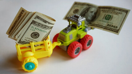 Toy truck with money. Lots of dollars.     