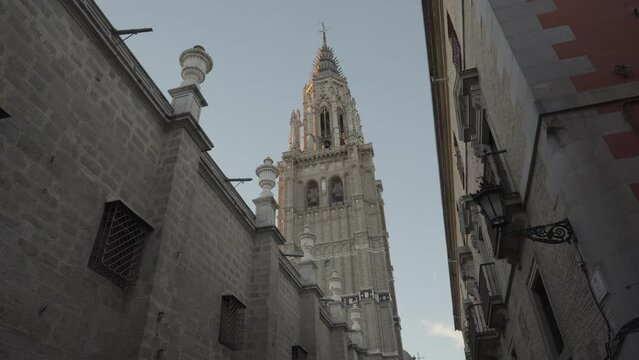 Narrow Alley Street in Old Quarter and The Cathedral Santa Iglesia Catedral Primada de Toledo Spain