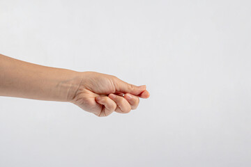 Hand of woman showing thumb-up gesture on white background