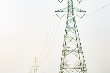 high voltage electric poles sky background