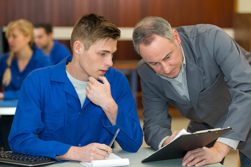 portrait of student mechanic in classroom