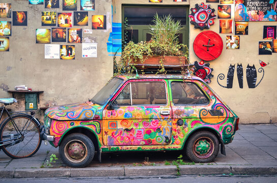 Krakow, Poland - October 21, 2012: Old Polish car Fiat 126 placed as a exhibit of local manufacture. Colorful car is part of the gallery, located on the former Jewish district Kazimierz, Krakow.