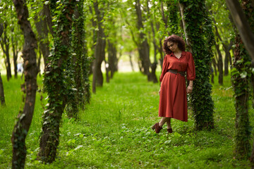 Candid of a mature curly hair redhead woman