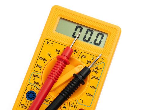 Digital multimeter with probes on a white background. 