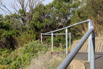 handrail on walking path up hill