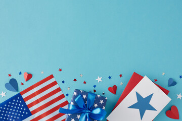 Obraz premium July 4th celebration theme concept.. Top view flat lay of gift boxes in national colors, american flag, red, white, and blue stars on light blue background with empty space for advert or text