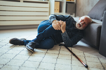 Elderly Senior Man Slip And Fall. Fallen Old Person in the Living Room.  Senior man falling down on...