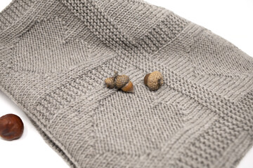 Brown wool knitted blanket in hearts knitting pattern on a white background close up