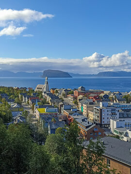 The view of Hammerfest town with Hammerfest church, surrounded by sea, mountains, and islands, Finnmark, Norway
