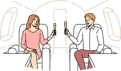 Happy couple drink on private jet
