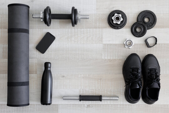Top view of black workout equipment for training with copy space