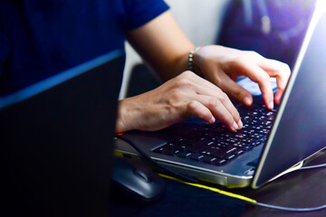 person typing on a laptop