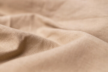Fototapeta premium Natural linen fabric texture. Rough crumpled burlap background. Selective focus