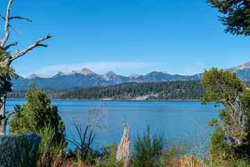 Fototapeta na wymiar Nahuel Huapi Lake, an emblem of Patagonian splendor, entices adventurers with its crystalline waters and awe-inspiring vistas