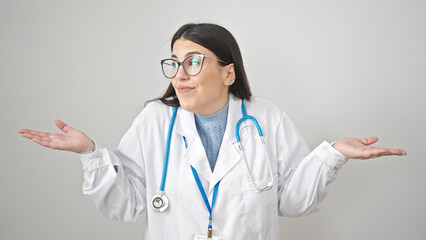 Young hispanic woman doctor standing clueless over isolated white background