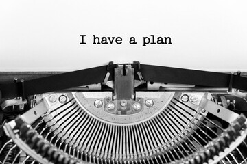 I have a plan phrase close up being typing and centered on a sheet of paper on old vintage typewriter mechanical