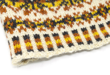 Fair Isle tweed wool knitted hat in white, yellow, orange and black, flat lay nordic beanie...