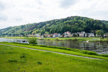Fototapeta na wymiar Small houses on the banks of the Elbe River near Bad Schandau