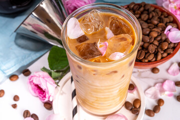 Iced Rose flower latte coffee drink, with pink rose petals taste almond milk, espresso, crushed ice