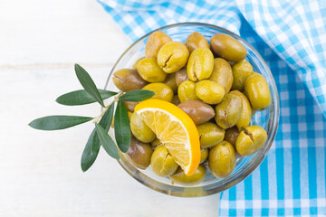 Cracked green olives. Cracked green olives with lemon. Turkish style olive (Turkish name; kirma zeytin)