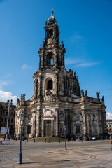 Fototapeta na wymiar Hofkirche (Cathedral of the Holy Trinity) in Dresden, plain blue sky and white clouds