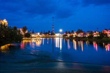 Fototapeta premium Night view of small Dong Nai lake - a central lake in Bao Loc city.