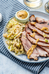 pork knuckle with stew cabbage on a plate