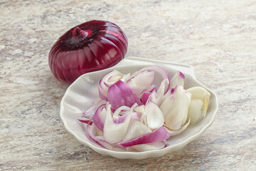 Sliced red onion in the bowl