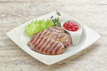 Grilled pork neck steak with ketchup