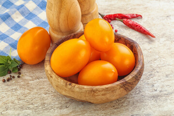 Sweet ripe yellow tomato in the bowl