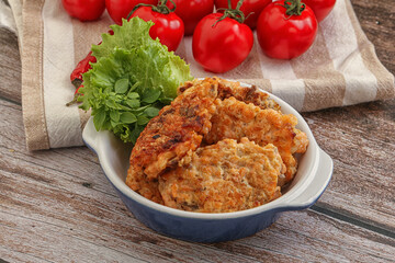 Fried salmonn cutlet in the bowl