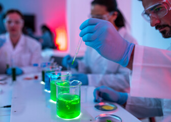 Laboratory Research, scientific glassware for chemical on focus and people working as background,...