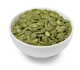 Bowl with green pumpkin seeds isolated on white background