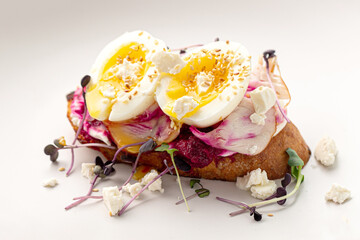 Gourmet bruschetta toast with egg and vegetables