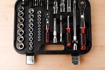 A set of working tools in black plastic bag, a screwdriver, adjustable spanner, sockets for repair...