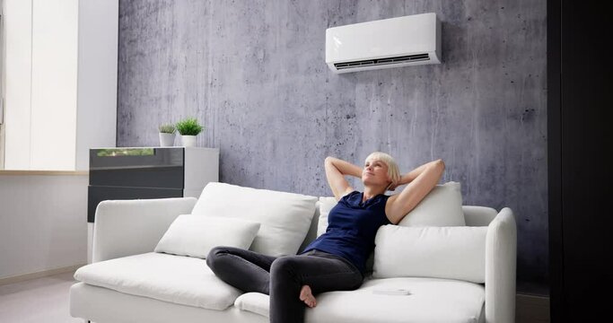 Happy Young Woman Relaxing Under The Air