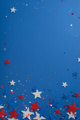 Overhead vertical shot of festive party decorations for Independence Day. Glitter stars and...