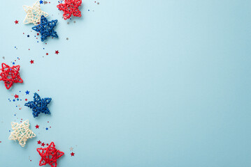 Create enchanting ambiance for your Independence Day celebration with symbolic party elements: top view of rattan stars and sparkle confetti. Pastel blue backdrop includes empty space for text or ad