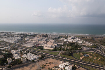 Filming the Royal Opera House from the sky, showing the beauty of the sea and the markets next to it, and it is considered the first opera house in the Middle East region
