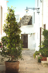 Alberobello Puglia Italy is famous for its trulli, which are small, round houses topped with conical roofs made of stone