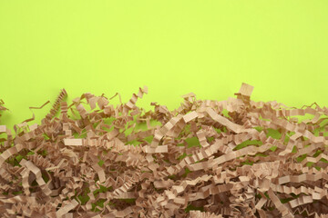 The shredded paper on light green background.