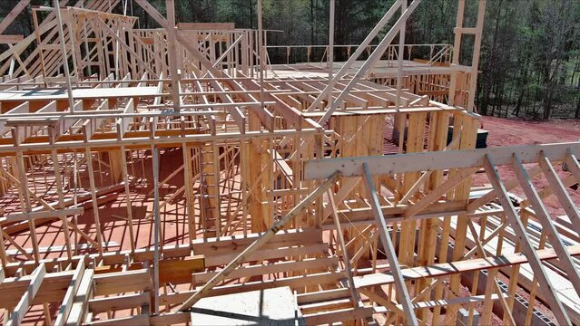 Construction frame house of wooden beam stick frame on new build home