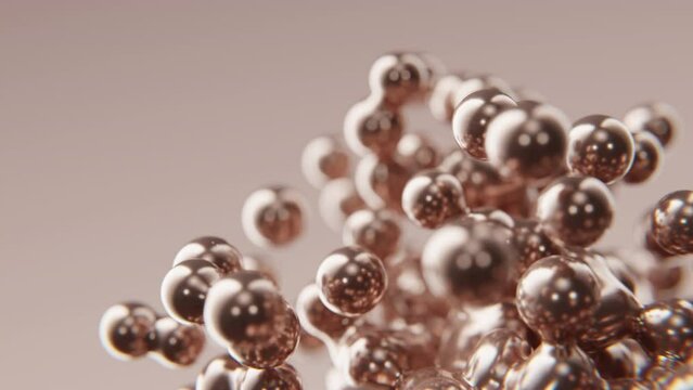 Gold beads golden meta balls metallic pearls metal shiny precious jewelry bubbles drops spheres mercury orbs flying slow motion moving 3d render digital animation graphic background backdrop wallpaper
