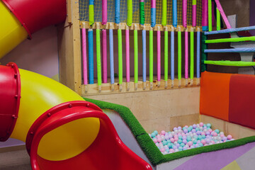 plastic slider in the children's playground. children's slide in the playroom.