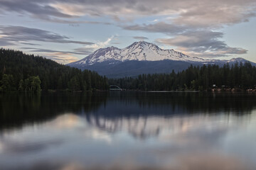 Snow Capped Mount Shasta Reflected in Lake Siskiyou on Cloudy Evening