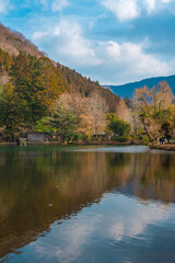 Kyushu, Yufuin, Beautiful winter in lake kinrin, small lake with clear water from a hot spring and Mount Yufu in Sunny day, Oita, Japan.