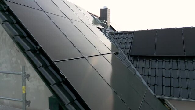 Close flight over a sustainable single family house with solar panels