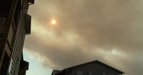 Time Lapse Black Smoke From Wildfire in the City, Sky View With Sun and Wooden Tenements, Canada, Dartmouth. Smoke From Forest Fire Closes Sun, Natural Breeze, Evacuation of People From Fires Forest 